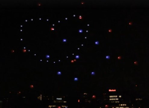 See Drones Draw Shapes in the Night Sky